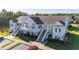 Aerial view showing a light tan building with multiple units and surrounding landscape at 111 Portsmith Dr. # 6, Myrtle Beach, SC 29588