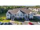 Aerial view of a community of tan buildings with parking and landscaping at 111 Portsmith Dr. # 6, Myrtle Beach, SC 29588