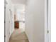 Hallway with light-colored walls, carpeted floors, and a partial kitchen view at 111 Portsmith Dr. # 6, Myrtle Beach, SC 29588
