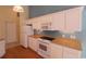 Bright kitchen with white cabinets and modern appliances at 172 Collins Glen Dr., Murrells Inlet, SC 29576