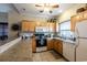 Well-equipped kitchen with light wood cabinets and appliances at 4880 Dahlia Ct. # 305, Myrtle Beach, SC 29577