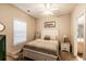Bright bedroom featuring a queen-size bed and window coverings at 4880 Dahlia Ct. # 305, Myrtle Beach, SC 29577