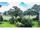 Landscaped backyard with lush greenery and golf course views at 4880 Dahlia Ct. # 305, Myrtle Beach, SC 29577