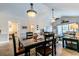 Dining area with a table and chairs, adjacent to the living room at 4880 Dahlia Ct. # 305, Myrtle Beach, SC 29577