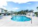 Community pool with lounge chairs and a nearby restroom at 4880 Dahlia Ct. # 305, Myrtle Beach, SC 29577