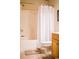 Clean bathroom with shower/tub combo, toilet and wood vanity at 4880 Dahlia Ct. # 305, Myrtle Beach, SC 29577