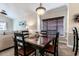Dining area with dark wood table and four chairs at 4880 Dahlia Ct. # 305, Myrtle Beach, SC 29577