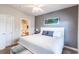 King-size bed and ensuite bathroom with beach decor at 4880 Dahlia Ct. # 305, Myrtle Beach, SC 29577