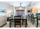 Bright dining area with table and chairs,window, and view to living room at 4880 Dahlia Ct. # 305, Myrtle Beach, SC 29577