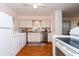 White kitchen with stainless steel appliances and view of stove at 114 N Pinewood Dr. N, Surfside Beach, SC 29575