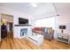 Cozy living room featuring a fireplace and light hardwood floors at 114 N Pinewood Dr. N, Surfside Beach, SC 29575