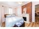 Main bedroom with fireplace and hardwood floors at 114 N Pinewood Dr. N, Surfside Beach, SC 29575