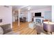 Bright living room with fireplace, hardwood floors, and comfortable seating at 114 N Pinewood Dr. N, Surfside Beach, SC 29575