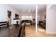 Combined dining and living area with hardwood floors and fireplace at 114 N Pinewood Dr. N, Surfside Beach, SC 29575
