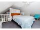 Upstairs bedroom with a room divider and teal chair at 114 N Pinewood Dr. N, Surfside Beach, SC 29575