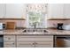 Kitchen sink and counter with granite and white cabinets at 114 N Pinewood Dr. N, Surfside Beach, SC 29575