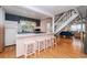Kitchen with an island and white barstools, view of living room at 114 N Pinewood Dr. N, Surfside Beach, SC 29575