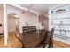 Charming dining area with a rustic wood table and built-in shelving at 114 N Pinewood Dr. N, Surfside Beach, SC 29575