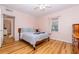 Cozy bedroom with light wood floors and a view of another room at 114 N Pinewood Dr. N, Surfside Beach, SC 29575