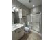 Clean bathroom with shower/tub combo, vanity, and linen storage at 4893 Magnolia Pointe Ln. # 103, Myrtle Beach, SC 29577