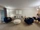Spacious living room with a cozy seating arrangement, neutral decor, and access to a patio at 4893 Magnolia Pointe Ln. # 103, Myrtle Beach, SC 29577