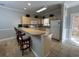 Well-equipped kitchen with ample counter space, cabinets, and a breakfast bar at 4893 Magnolia Pointe Ln. # 103, Myrtle Beach, SC 29577