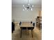 Modern dining room with a sleek wooden dining table and stylish chairs at 4893 Magnolia Pointe Ln. # 103, Myrtle Beach, SC 29577