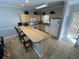Modern kitchen with light cabinets, breakfast bar, and stainless steel appliances at 4893 Magnolia Pointe Ln. # 103, Myrtle Beach, SC 29577
