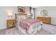 Bedroom with patterned bedding and dresser at 651 Wallace Dr., Little River, SC 29566