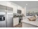 Modern kitchen with white cabinets, granite countertops, and stainless steel appliances at 651 Wallace Dr., Little River, SC 29566