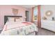 Bedroom with pink walls and cactus bedding at 651 Wallace Dr., Little River, SC 29566