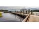 Wooden dock with casino boat in the background at 651 Wallace Dr., Little River, SC 29566