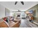 Relaxing living room featuring hardwood floors, a fireplace, and a large TV at 3005 Wildhorse Circle, Conway, SC 29526