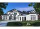 Luxury home with a modern design, three-car garage, and manicured landscaping at 9793 Anchor Dr., Longs, SC 29568