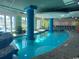 Indoor pool with large windows and comfortable seating at 300 N Ocean Blvd. # 107, North Myrtle Beach, SC 29582