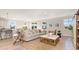 Open living room with a light beige sofa and a view into the kitchen at 562 Slaty Dr., Myrtle Beach, SC 29588