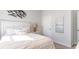 Bedroom with white bedding, neutral decor, and natural light at 7302 Meadow Walk Loop, Loris, SC 29569