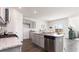 Modern kitchen with island, granite counters, and stainless steel appliances at 7302 Meadow Walk Loop, Loris, SC 29569