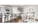 Modern kitchen with gray cabinets, granite counters, and an island at 7302 Meadow Walk Loop, Loris, SC 29569