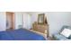 Bedroom with blue bedding and a striped armchair at 7302 Meadow Walk Loop, Loris, SC 29569