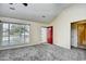 Living room with gray carpet, red front door, and neutral walls at 4336 Summitt Trail, Myrtle Beach, SC 29579