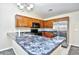 Kitchen with wood cabinets, granite countertops, and stainless steel appliances at 4336 Summitt Trail, Myrtle Beach, SC 29579