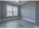 Spacious bedroom with large windows and wood floors at 845 Waterton Ave., Myrtle Beach, SC 29579