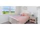 Bedroom with a pink bedspread and white furniture at 7335 Meadow Walk Loop, Loris, SC 29569
