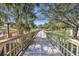 Scenic boardwalk path alongside a tranquil lake at 410 Melrose Pl. # 305, Myrtle Beach, SC 29572