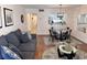 Open concept dining area with glass table and chairs, near the kitchen at 410 Melrose Pl. # 305, Myrtle Beach, SC 29572
