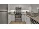 Well-equipped kitchen with stainless steel appliances at 410 Melrose Pl. # 305, Myrtle Beach, SC 29572