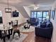 Spacious living room with hardwood floors and access to balcony at 410 Melrose Pl. # 305, Myrtle Beach, SC 29572