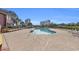 Community pool with plenty of lounge chairs for relaxation at 410 Melrose Pl. # 305, Myrtle Beach, SC 29572