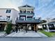 Three-story home with gray siding, multiple balconies, and elevated design at 6001 - 1191 S Kings Hwy., Myrtle Beach, SC 29575